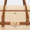 Handtasche aus Baumwoll-Canvas und Leder, puderfarben Handtasche aus Baumwoll-Canvas und Leder, puderfarben