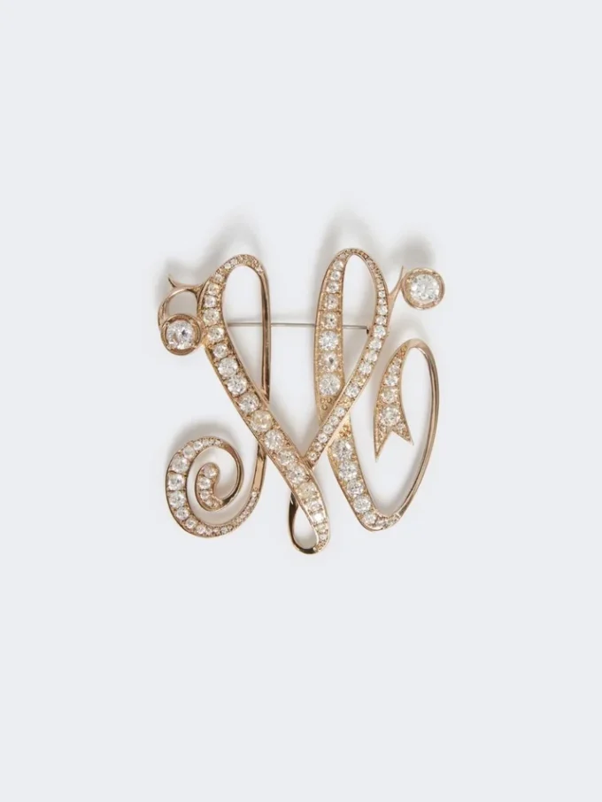 Monogramm-Brosche mit Strasssteinen, elfenbeinfarben Monogramm-Brosche mit Strasssteinen, elfenbeinfarben